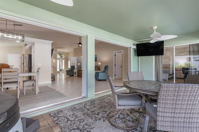 dining space with ceiling fan