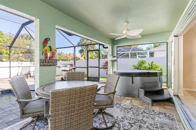 sunroom / solarium with ceiling fan