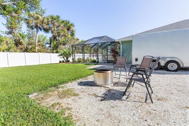 view of yard featuring glass enclosure