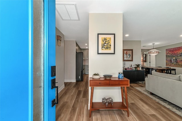 corridor featuring hardwood / wood-style flooring