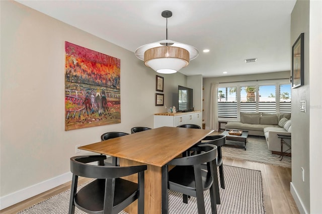 dining room featuring light hardwood / wood-style flooring