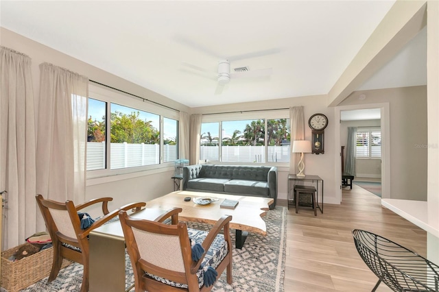 interior space with ceiling fan