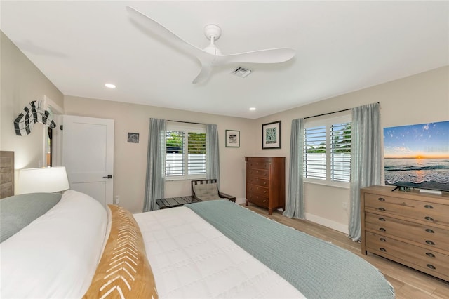 bedroom featuring ceiling fan and light hardwood / wood-style flooring