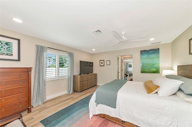 bedroom featuring ceiling fan and light hardwood / wood-style flooring