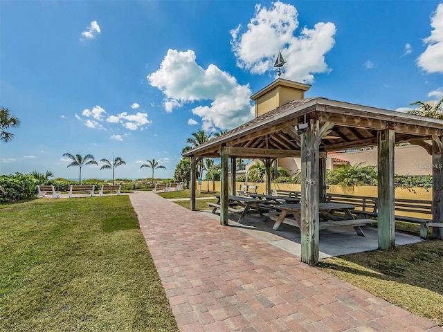 surrounding community featuring a gazebo and a yard