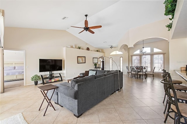 tiled living room with high vaulted ceiling and ceiling fan