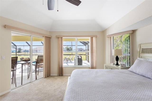 carpeted bedroom with access to exterior, ceiling fan, and lofted ceiling