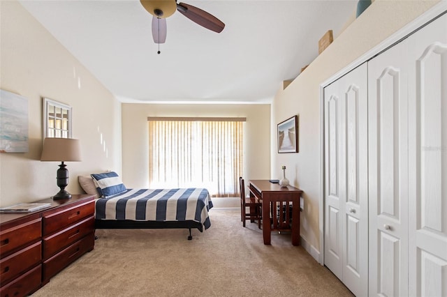 bedroom with light carpet, a closet, and ceiling fan