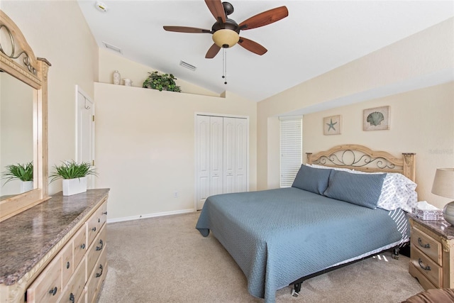 bedroom with light carpet, a closet, vaulted ceiling, and ceiling fan