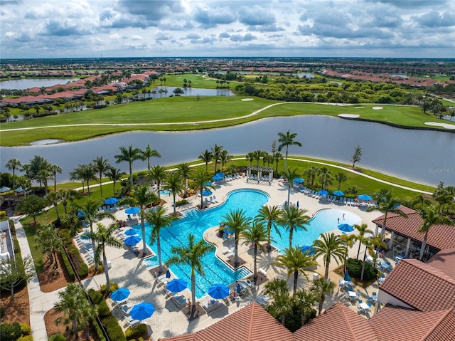 birds eye view of property with a water view