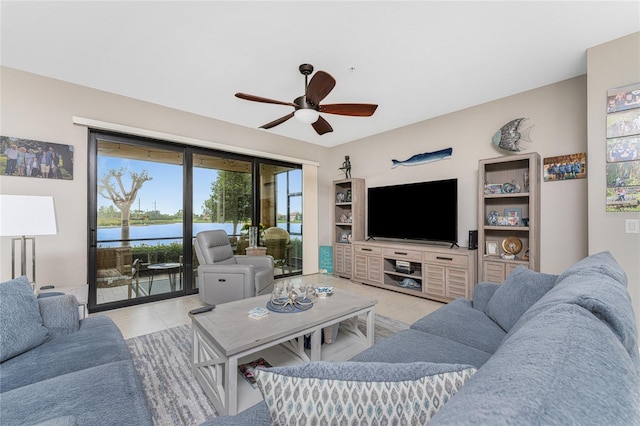 tiled living room with ceiling fan