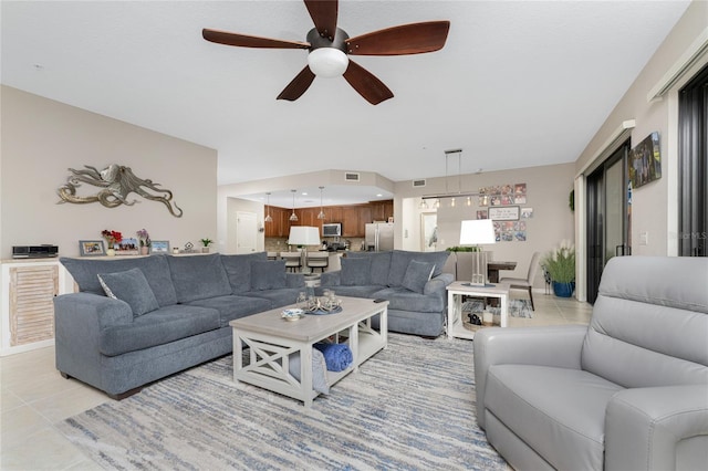 living room featuring ceiling fan and light tile patterned flooring