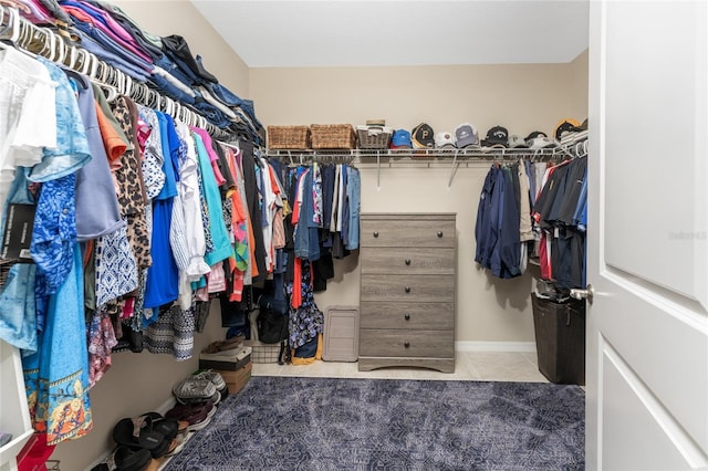 spacious closet featuring light tile patterned floors