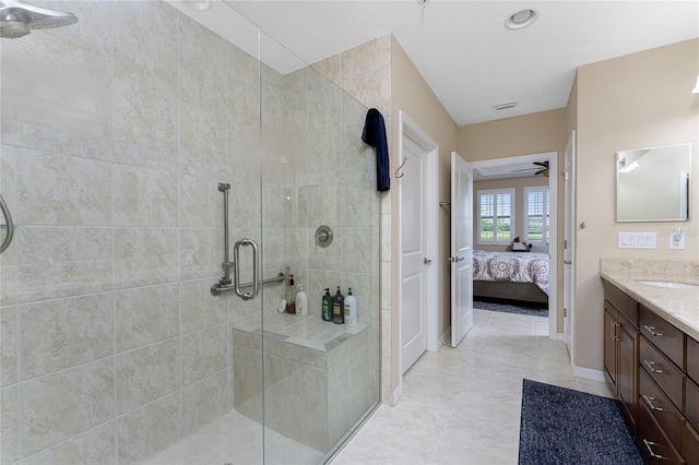 bathroom with vanity, ceiling fan, and walk in shower