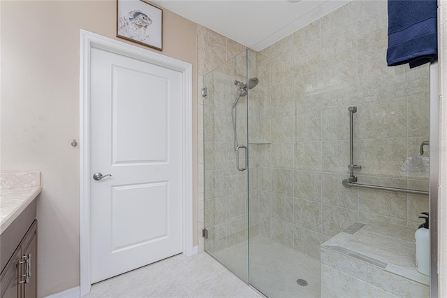 bathroom with vanity and a shower with shower door