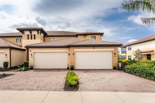 mediterranean / spanish house featuring a garage