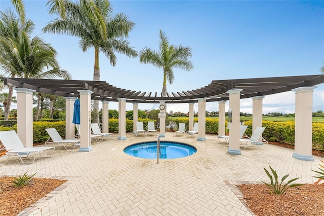 view of pool with a patio, a pergola, and a hot tub