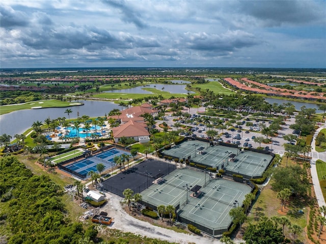 birds eye view of property with a water view