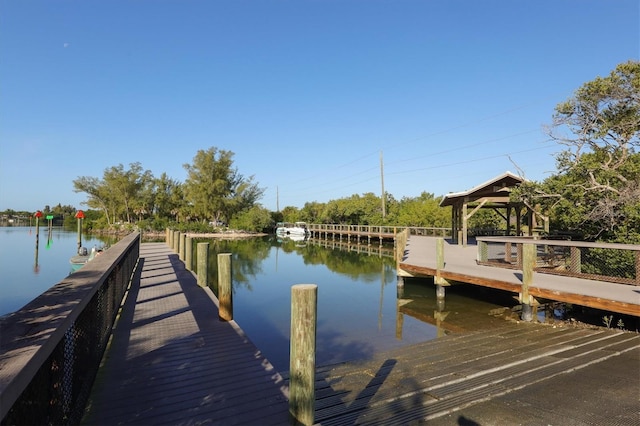 dock area featuring a gazebo and a water view