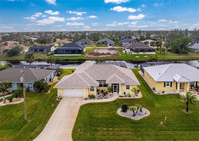 birds eye view of property with a water view