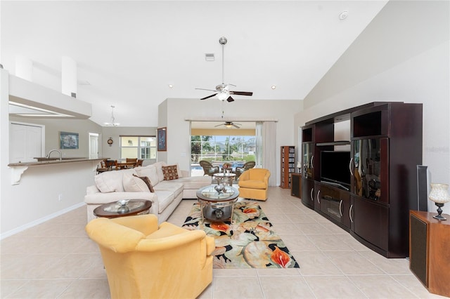 tiled living room with ceiling fan and lofted ceiling