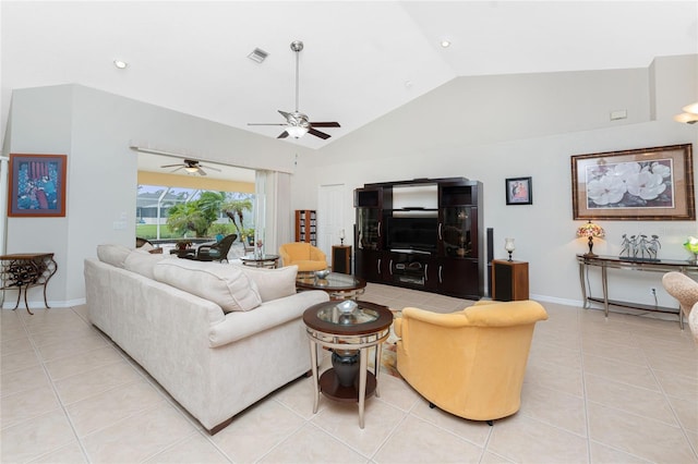 tiled living room featuring ceiling fan and high vaulted ceiling