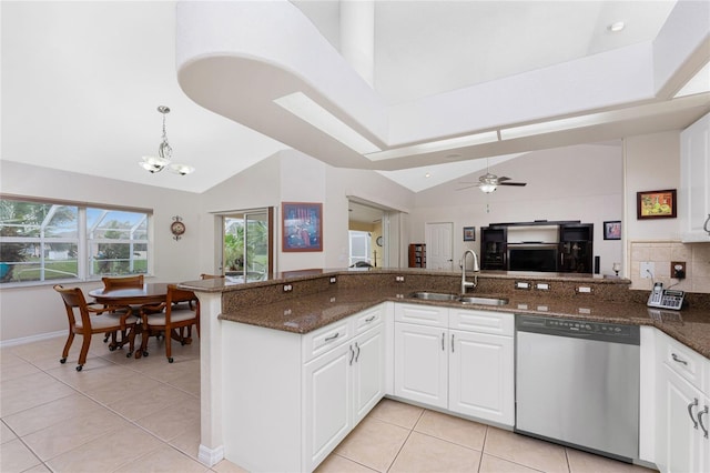 kitchen with dishwasher, white cabinets, dark stone counters, and sink