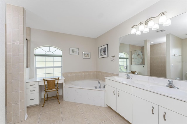 bathroom with tile patterned floors, vanity, separate shower and tub, and a wealth of natural light