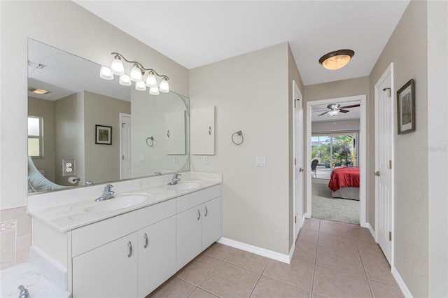 bathroom featuring tile patterned flooring, ceiling fan, and vanity