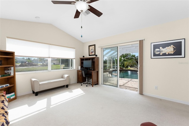 sitting room with ceiling fan, light colored carpet, and vaulted ceiling