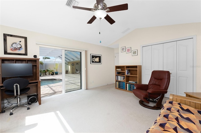 sitting room featuring carpet flooring, vaulted ceiling, and ceiling fan