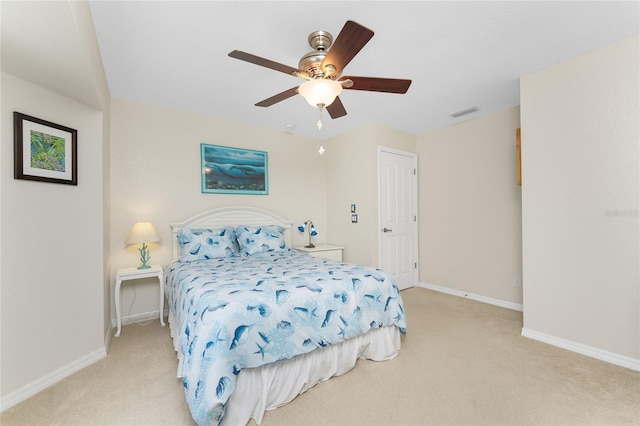 bedroom featuring ceiling fan and light colored carpet