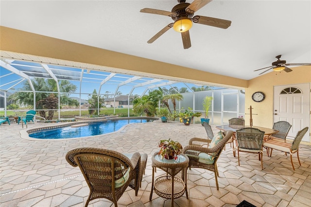 view of pool featuring a lanai, a patio area, and ceiling fan