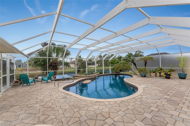 view of pool with a lanai and a patio area