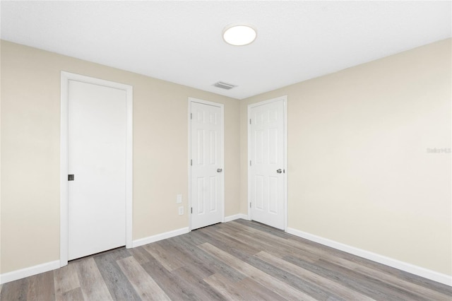 unfurnished bedroom featuring light hardwood / wood-style flooring