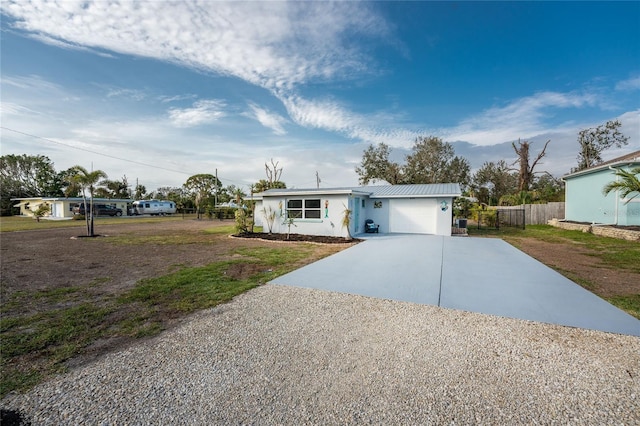 ranch-style house featuring a garage