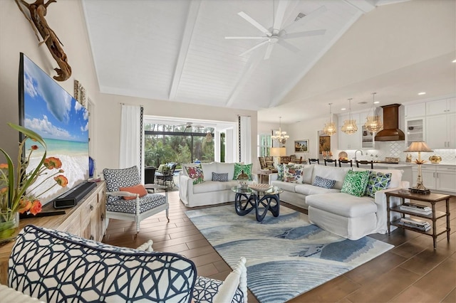 living room featuring beamed ceiling, ceiling fan with notable chandelier, and high vaulted ceiling