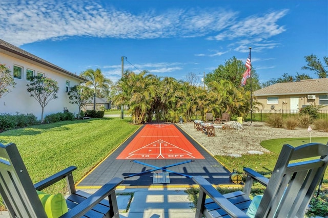 view of property's community featuring a yard