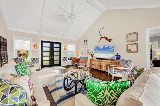 living room featuring ceiling fan, french doors, beamed ceiling, and dark wood-type flooring