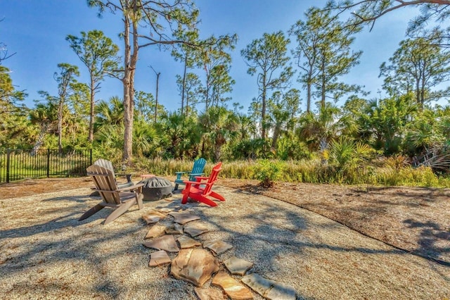 exterior space with an outdoor fire pit and a patio area