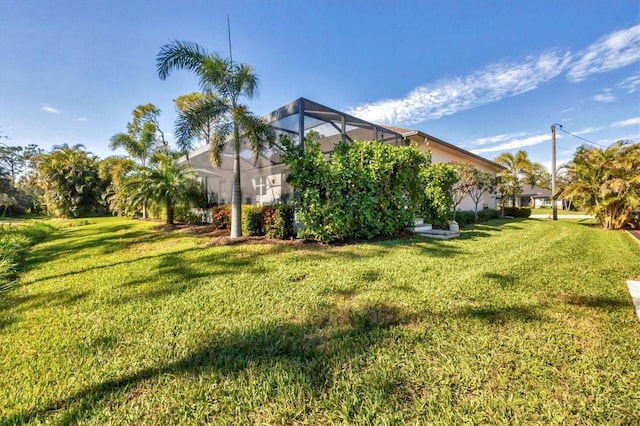 view of yard with a lanai