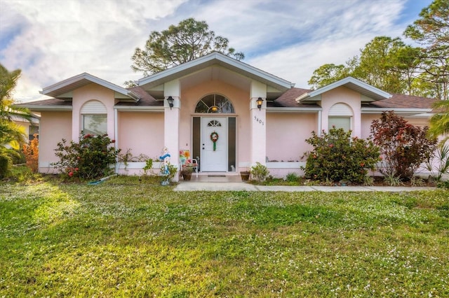 ranch-style home with a front yard