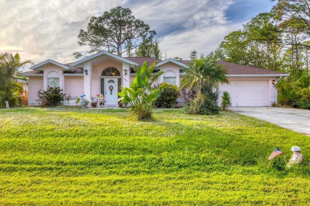 single story home with a front lawn and a garage