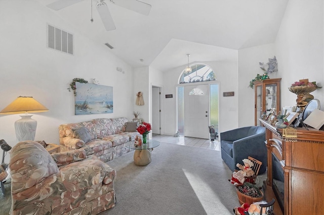 living room featuring light carpet, ceiling fan, and high vaulted ceiling