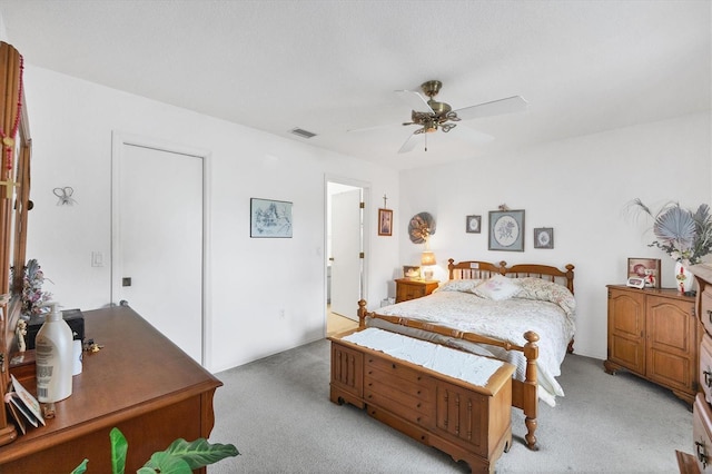 bedroom with light colored carpet and ceiling fan