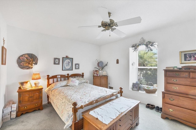 bedroom with ceiling fan and light colored carpet