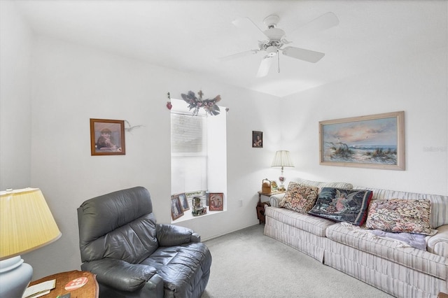 carpeted living room with ceiling fan