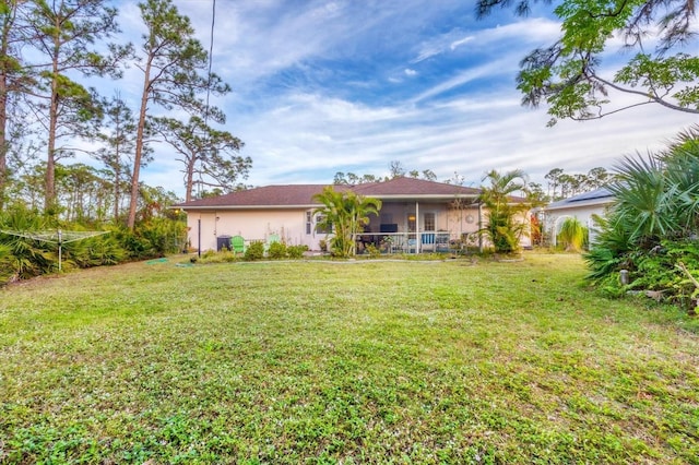 view of yard with a sunroom