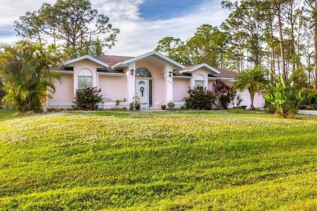 ranch-style home with a front yard