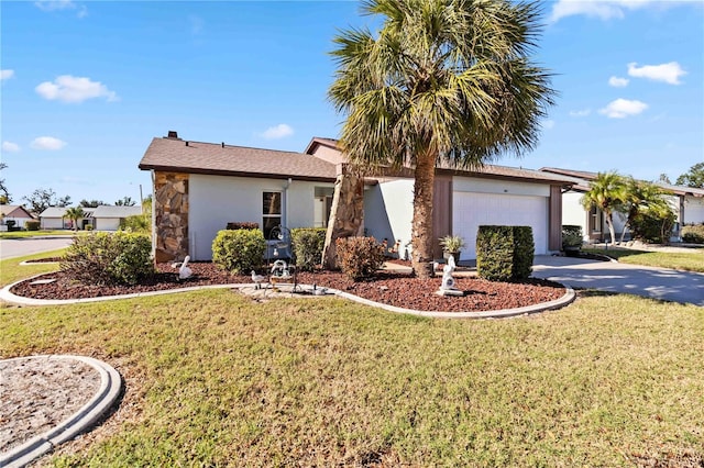 single story home featuring a garage and a front lawn